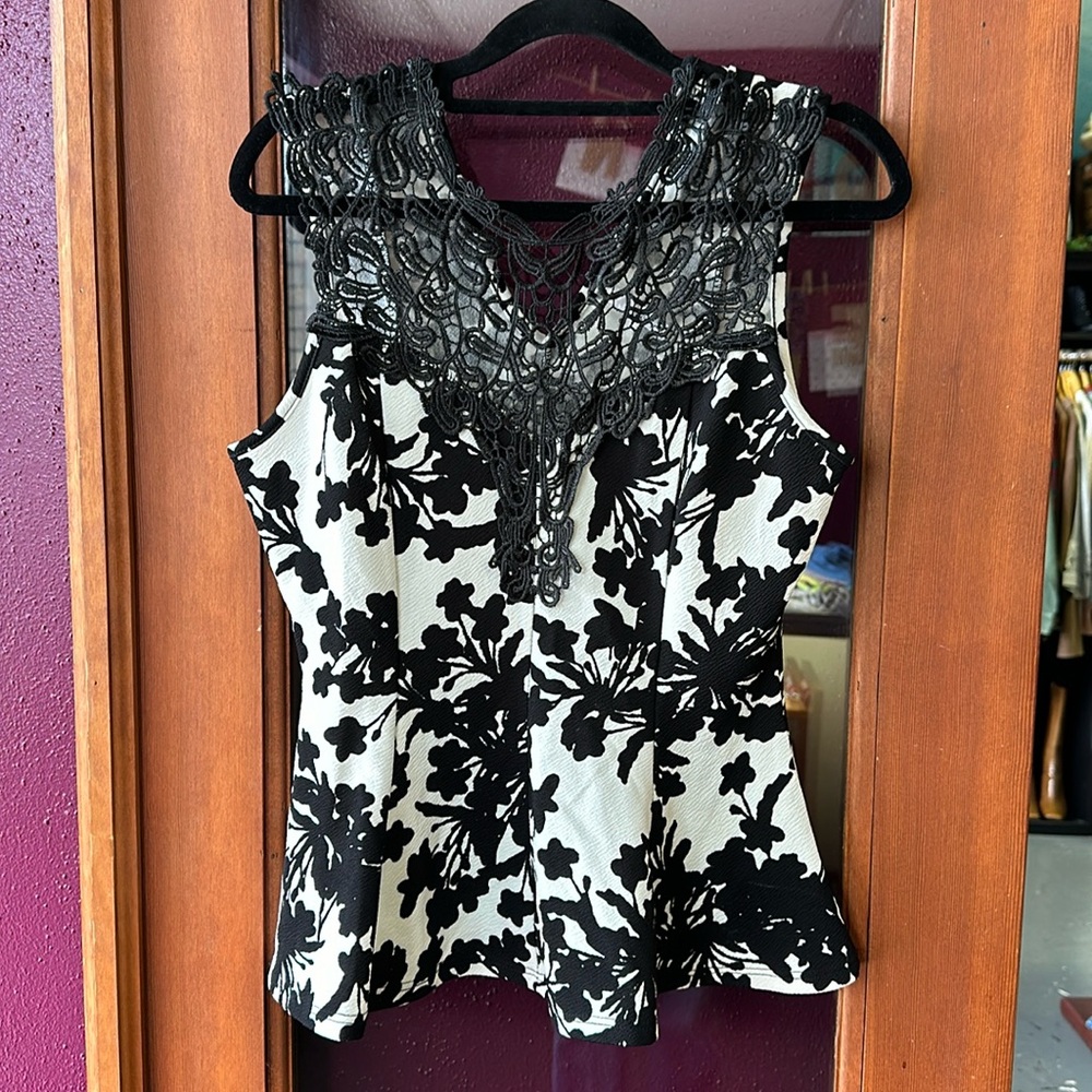 Black and white lacy peplum blouse